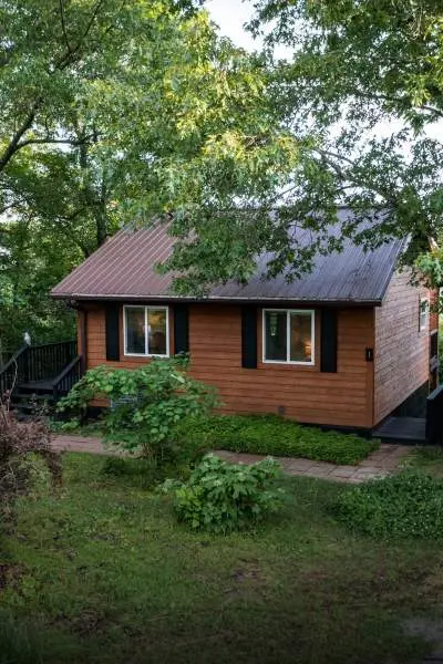 A wooden cabin between the trees