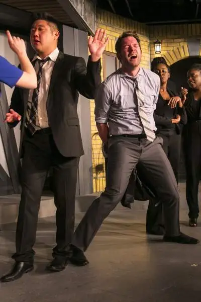 Actors acting on stage at the Chicago Theatre.