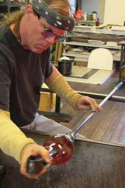 Guy designing glass