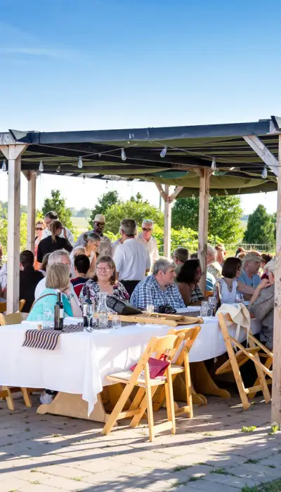 People gathered around tables and socialising.