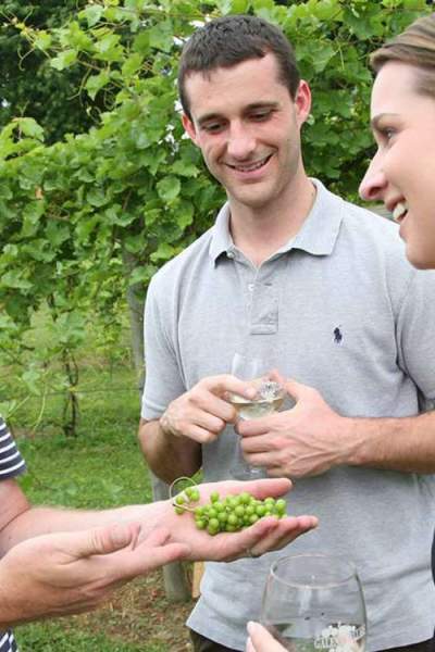 A winemaker talks grape varietals with visitors at Galena Cellars Vineyard and Winery.