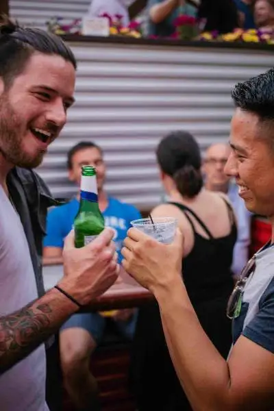 Two men drinking at a bar