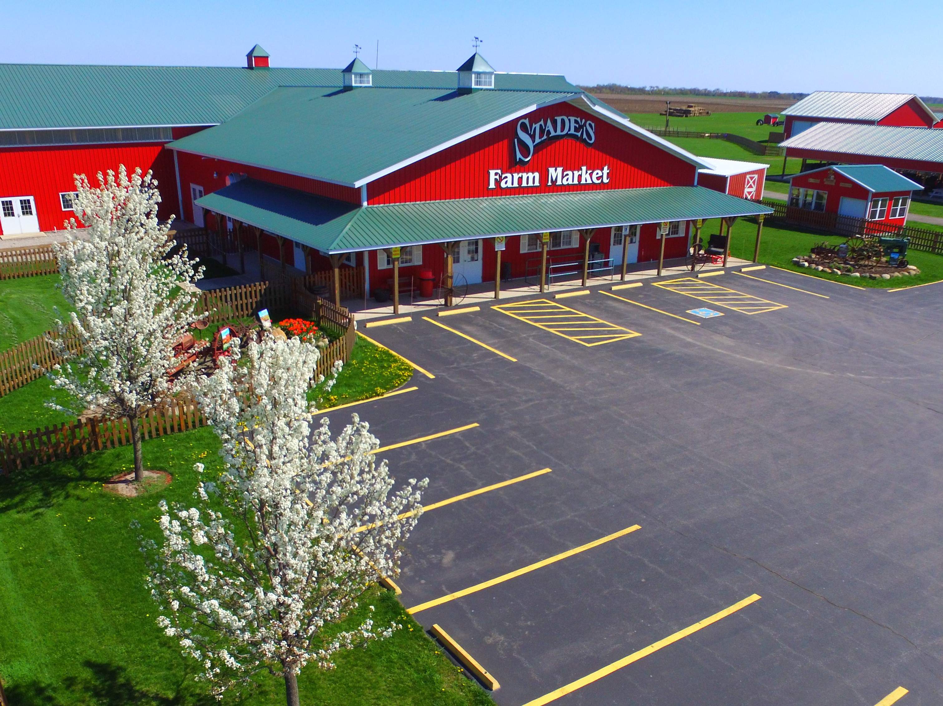 The exterior of the red barn-like Stade's Farm and Market in McHenry