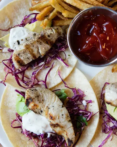 Tacos and fries on a plate