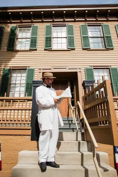 A house with a man standing in front