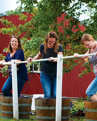 Women crush grapes at Galena Cellars