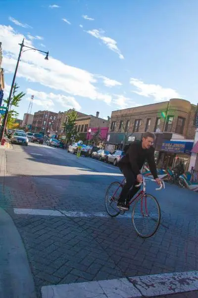 Man biking down Clark Street.