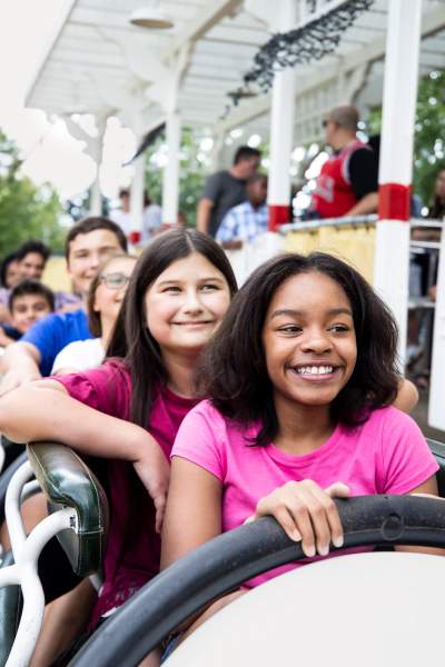 Kids on a amusement park ride at Six Flags.