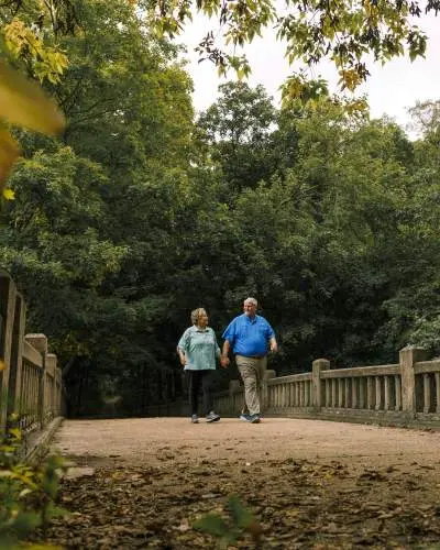 A couple walk in Matthiessen State Park in Oglesby