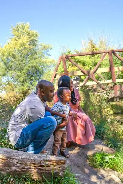 Family watching a creek