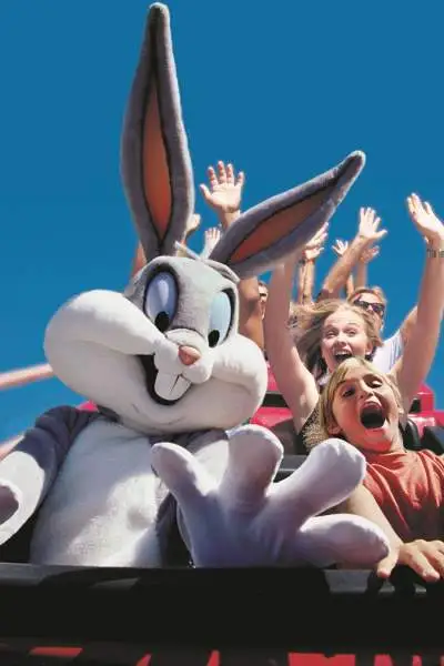 Kids on a rollercoaster with a person in a Bugs Bunny costume