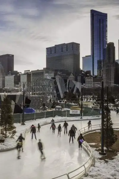 People ice skating in a park in Chicago