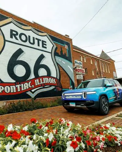 Rivian EV in front of the Route 66 Mural in Pontiac