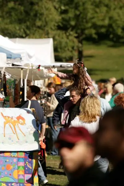 A market with lots of people looking at shops