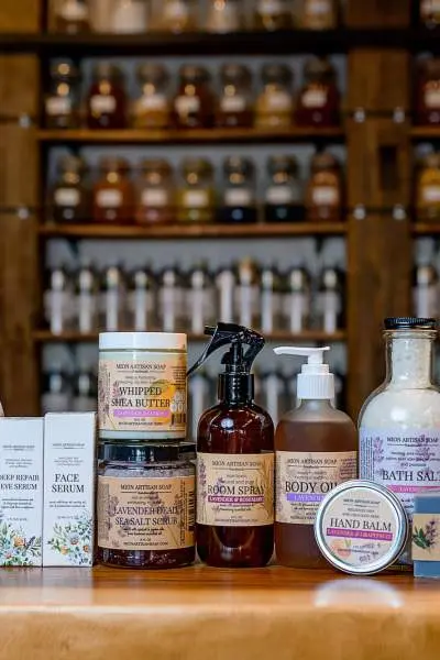 A selection of soaps and balms sitting on a counter at MION Artisan Soap in Wheaton, Illinois