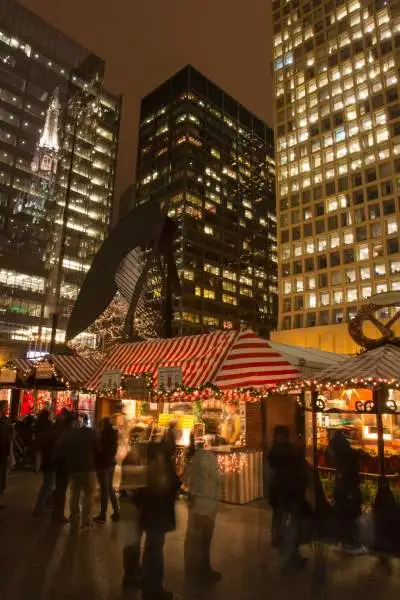 A market with a city behind it at night