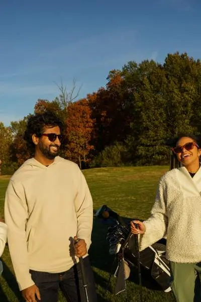 A group of four friends at a golf course