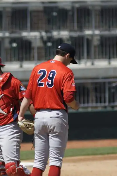 Peoria Chiefs players congregate on the mound